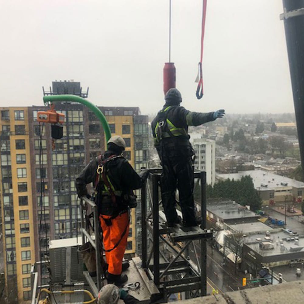 Setting tie-backs at the top of a Vancouver building